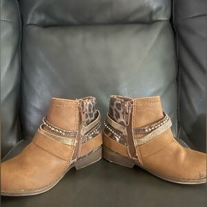 Size 5 boots for baby. Adorable designs on them. Worn once. A couple flaws.
